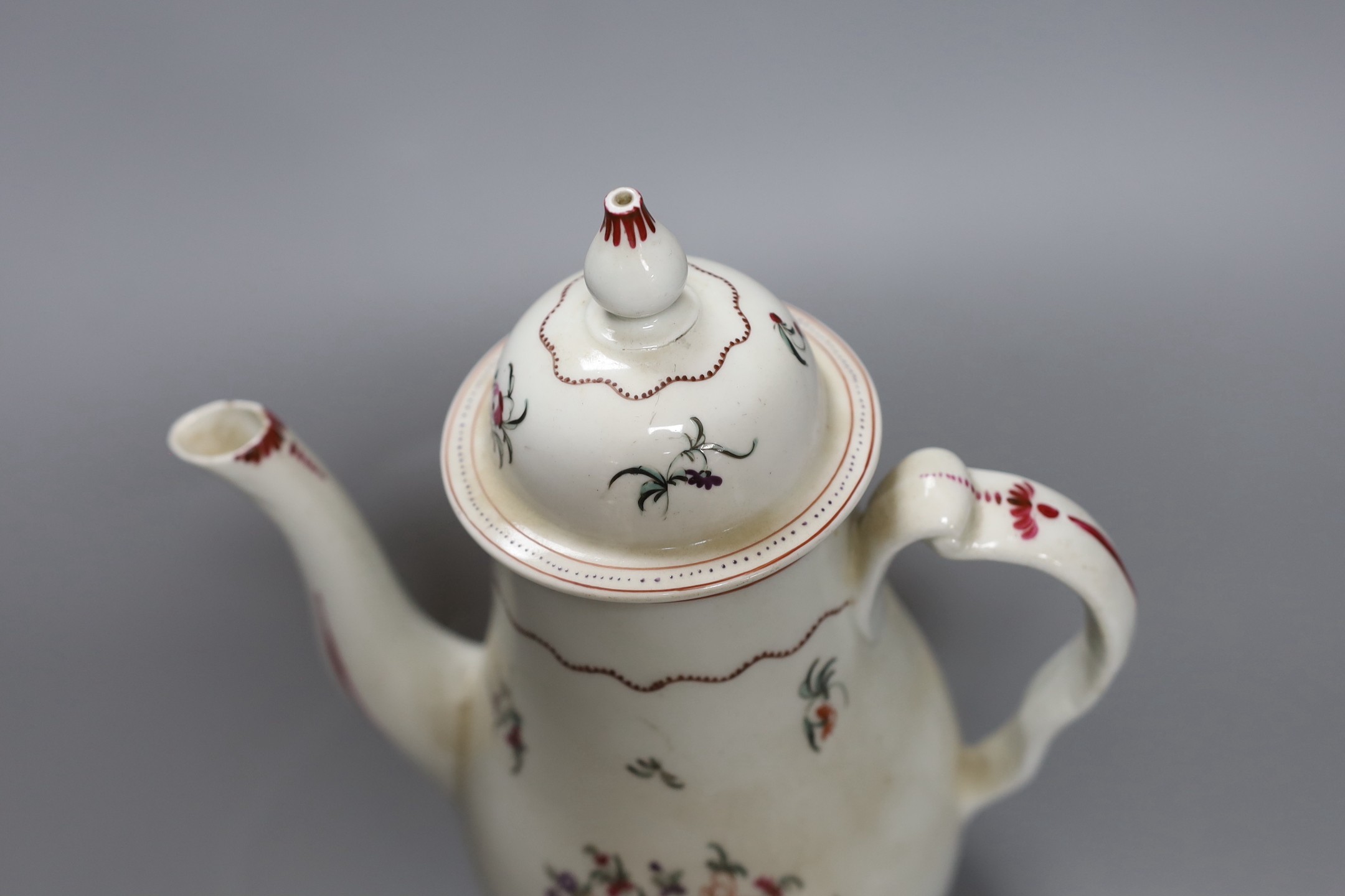 A Chinese export famille rose coffee pot and cover, circa 1800, 25 cms high